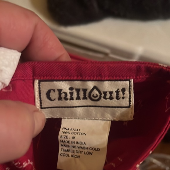 Red bandanna wrap style cover-up or skirt ties in front comes to a draping point - Picture 7 of 7